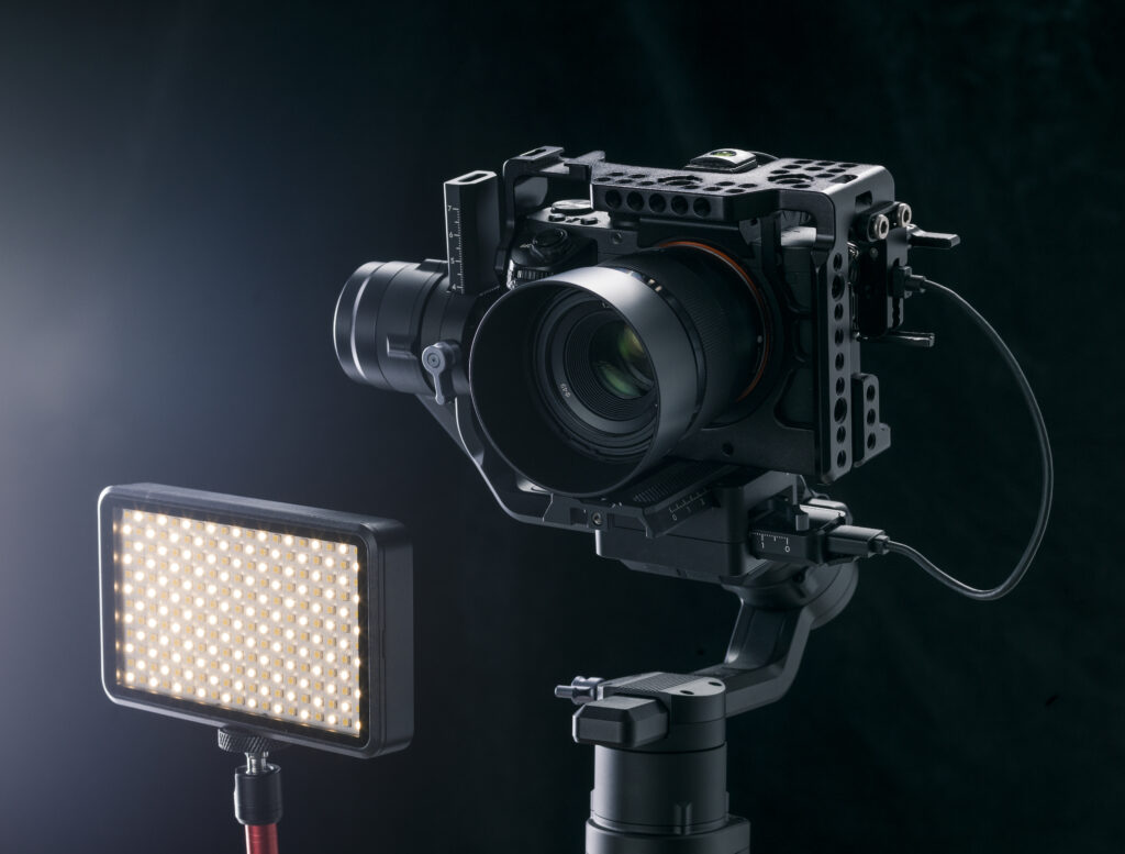 Professional digital camera on black background